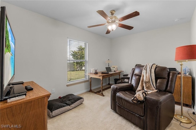 carpeted office space with ceiling fan