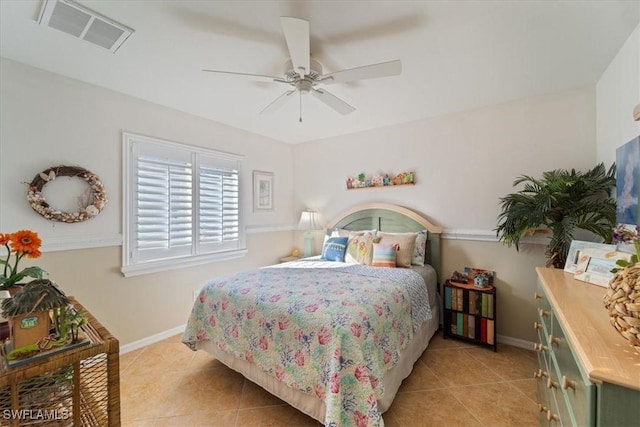 tiled bedroom featuring ceiling fan