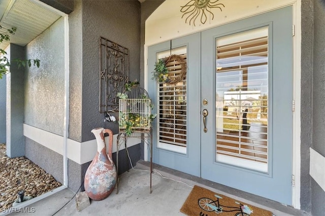 property entrance featuring french doors