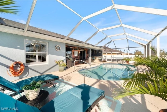 view of pool with a lanai and a patio area