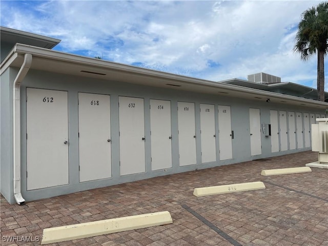 634 12th Ave S Unit 634, Naples, FL 34102 - view of home's exterior featuring mail area and a central AC unit