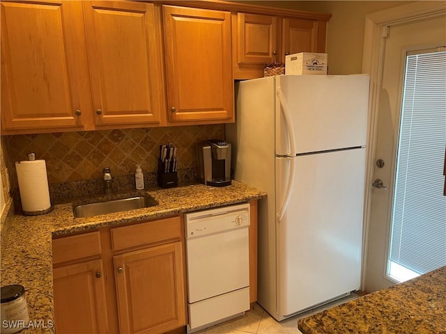 634 12th Ave S Unit 634, Naples, FL 34102 - kitchen featuring white appliances, backsplash, dark stone countertops, and light tile patterned flooring