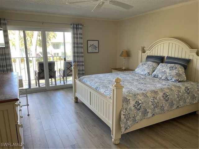 634 12th Ave S Unit 634, Naples, FL 34102 - bedroom featuring access to exterior, wood finished floors, a textured ceiling, crown molding, and ceiling fan