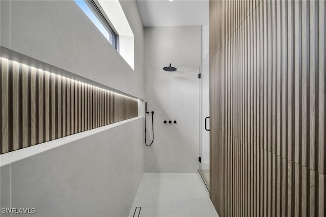 bathroom featuring a shower and tile patterned flooring