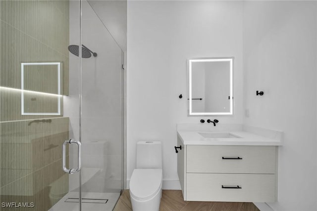 bathroom with an enclosed shower, vanity, and toilet