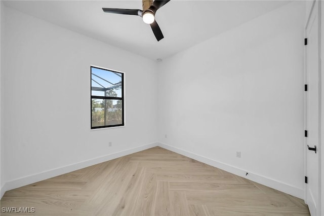 spare room with light parquet flooring and ceiling fan