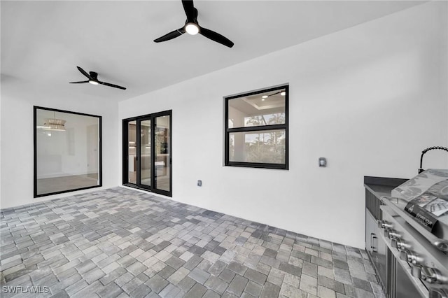 view of patio / terrace featuring ceiling fan