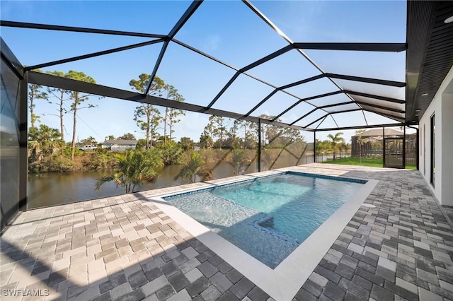 view of pool with a water view, a patio area, and a lanai