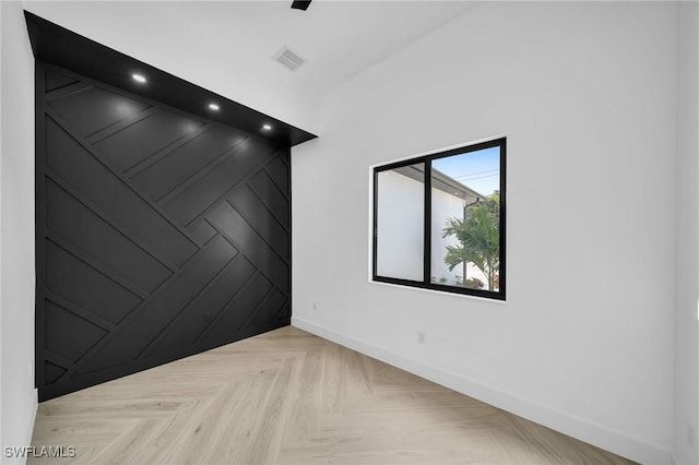 unfurnished room with light parquet floors