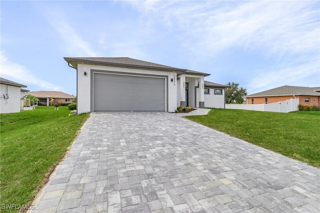 view of front facade featuring a front lawn and a garage