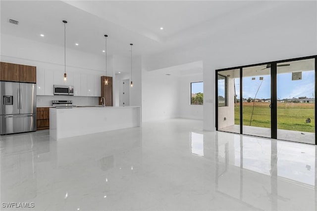 unfurnished living room with sink