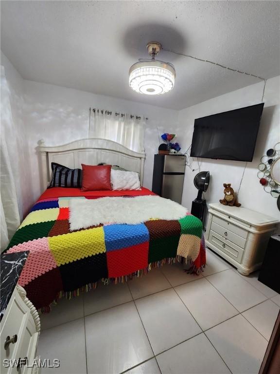 bedroom with light tile patterned floors