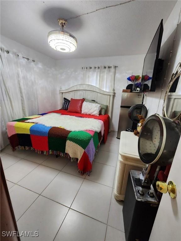 bedroom featuring light tile patterned flooring