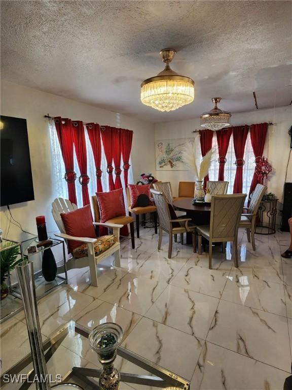 dining room with a textured ceiling