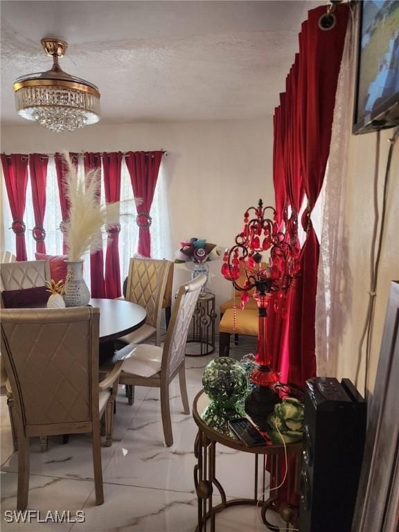 dining space featuring a textured ceiling