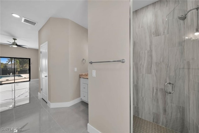 bathroom featuring vanity, an enclosed shower, and ceiling fan