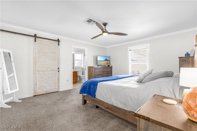 bedroom featuring ceiling fan, a barn door, crown molding, ensuite bathroom, and light carpet