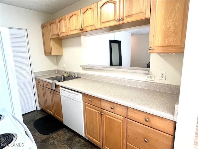 kitchen featuring white dishwasher, light brown cabinets, range, and sink