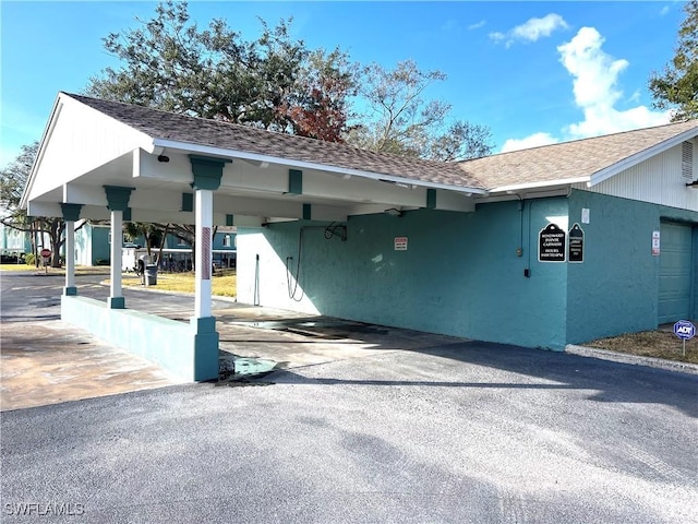 exterior space featuring a carport