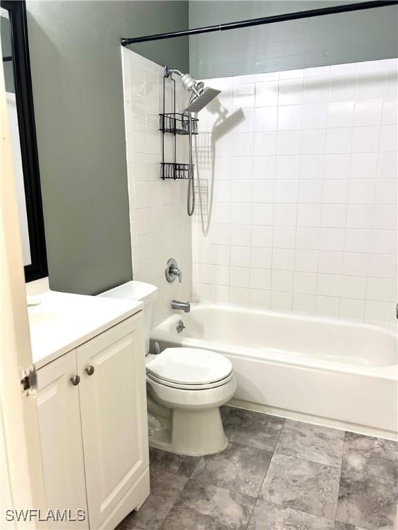 full bathroom with vanity, toilet, and tiled shower / bath