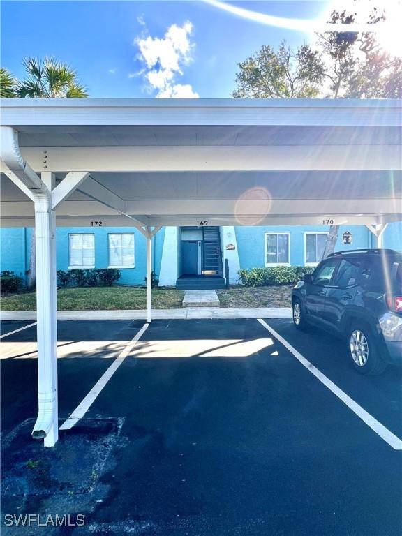 view of parking with a carport