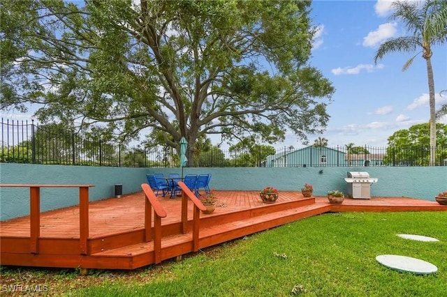 dock area featuring a deck and a yard