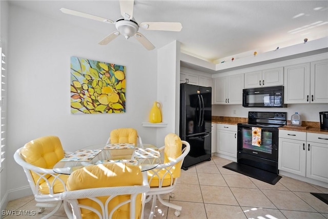 kitchen featuring black appliances, ceiling fan, white cabinetry, and light tile patterned floors