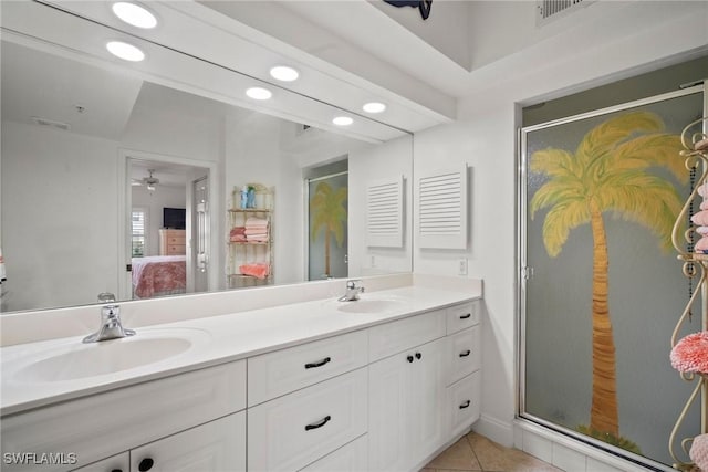 bathroom featuring ceiling fan, tile patterned flooring, vanity, and walk in shower