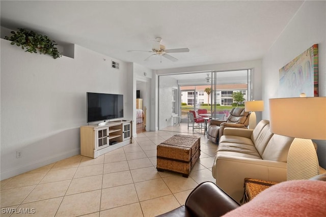 living room with ceiling fan and light tile patterned flooring