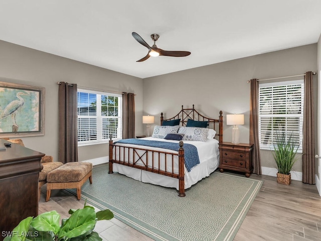 bedroom featuring light hardwood / wood-style flooring and ceiling fan