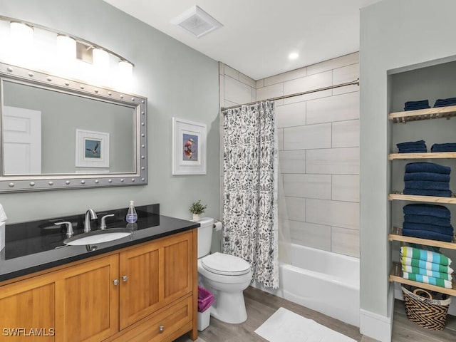 full bathroom with toilet, vanity, shower / tub combo, and hardwood / wood-style flooring