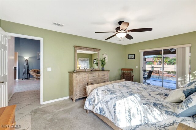 bedroom featuring access to exterior, ceiling fan, and light tile patterned flooring