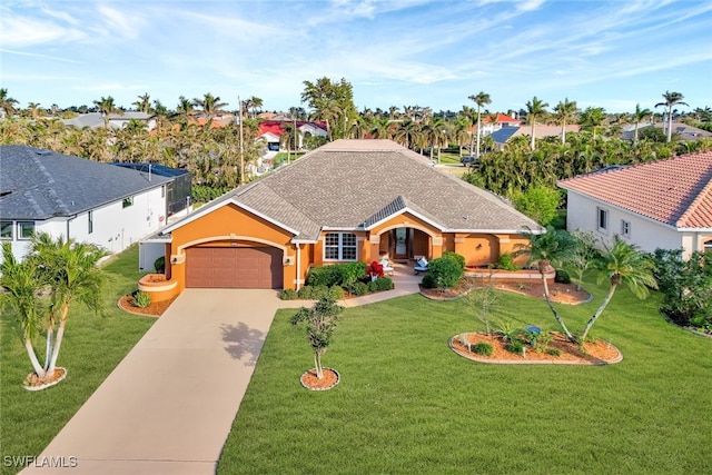 view of front of home featuring a front yard and a garage