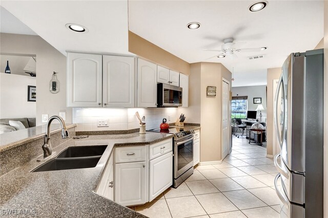 kitchen featuring white cabinets, ceiling fan, sink, and appliances with stainless steel finishes