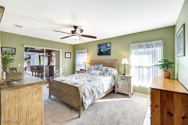 carpeted bedroom with access to exterior and ceiling fan