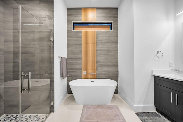 bathroom with vanity, tile patterned floors, and independent shower and bath