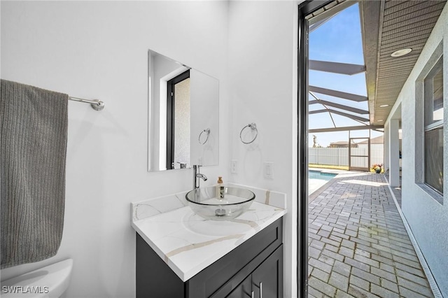 bathroom featuring vanity and toilet