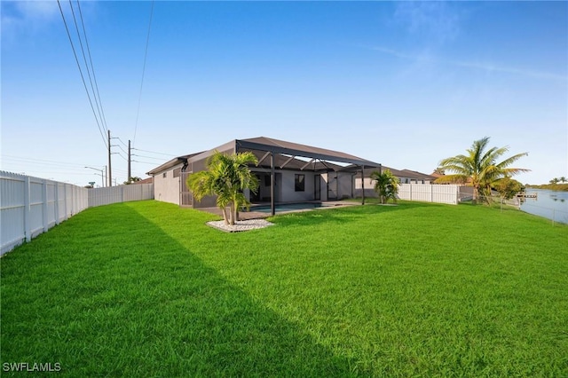 view of yard featuring a lanai and a swimming pool