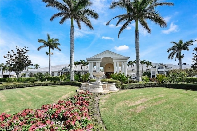 view of property's community with a lawn