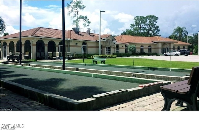 1051 Eastham Way Unit B-204, Naples, FL 34104 - surrounding community with a game area and a yard