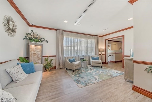 living room featuring light hardwood / wood-style flooring and ornamental molding