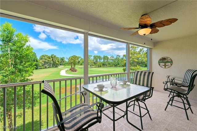 sunroom / solarium with ceiling fan