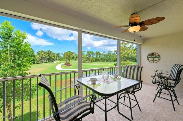 1051 Eastham Way Unit B-204, Naples, FL 34104 - sunroom featuring view of golf course, a ceiling fan, and view of scattered trees