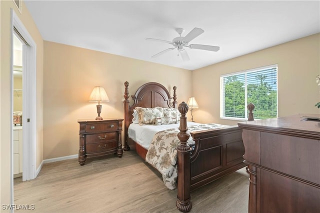 1051 Eastham Way Unit B-204, Naples, FL 34104 - bedroom featuring light wood-style flooring, ceiling fan, and baseboards