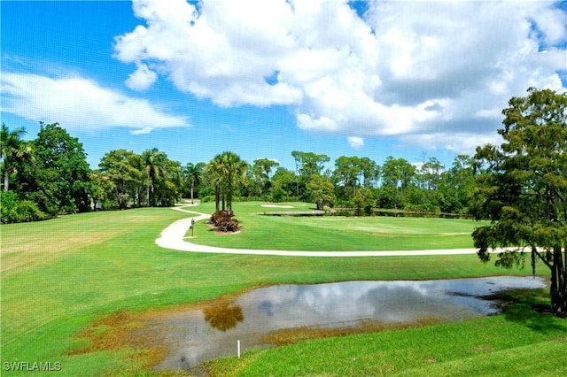 1051 Eastham Way Unit B-204, Naples, FL 34104 - view of community with view of golf course, view of scattered trees, a yard, and a water view