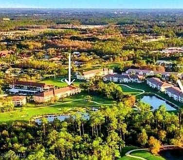1051 Eastham Way Unit B-204, Naples, FL 34104 - aerial view of a large body of water and a local golf course