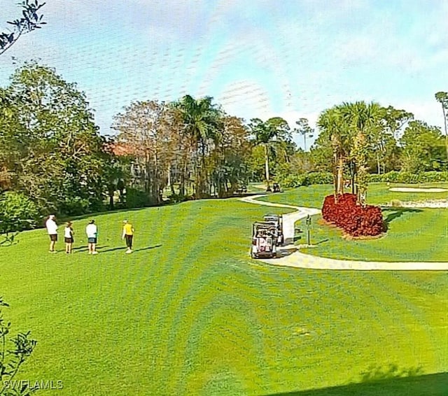 1051 Eastham Way Unit B-204, Naples, FL 34104 - view of community featuring view of scattered trees and a lawn