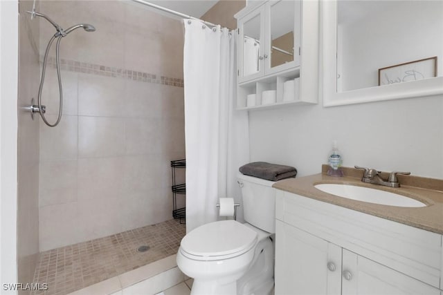 bathroom with vanity, curtained shower, and toilet