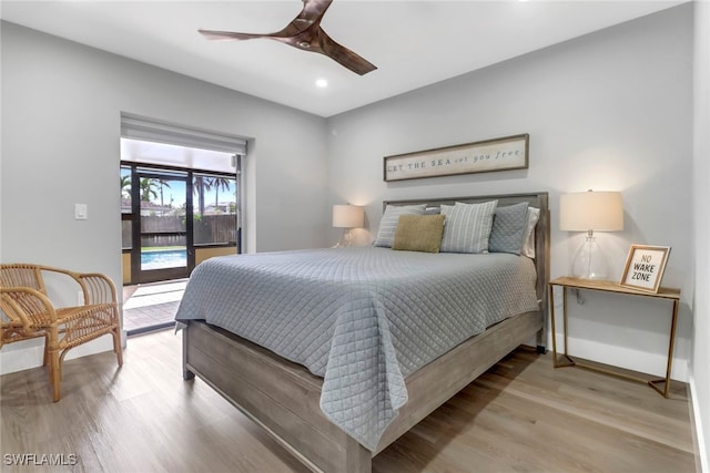 bedroom with access to exterior, ceiling fan, and hardwood / wood-style floors