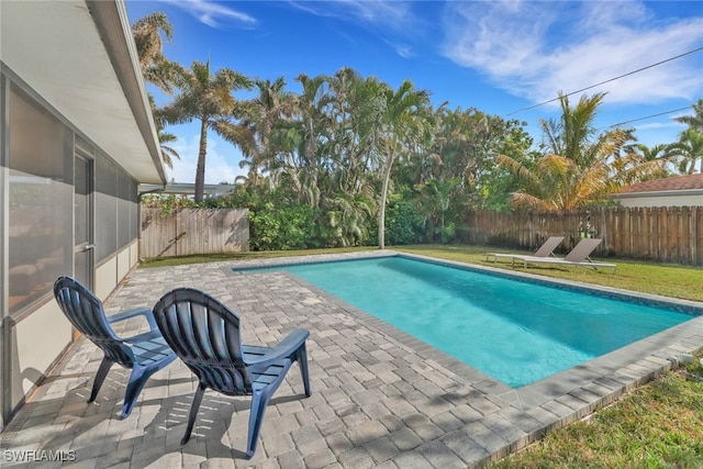 view of swimming pool with a patio